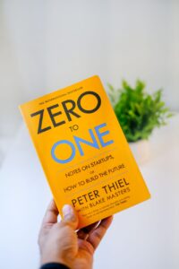a person holding a yellow book